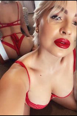 blonde lingerie waitress with bright red lips and underwear to match in the gold coast's ashmore area